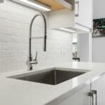 Modern kitchen sink with chrome tap