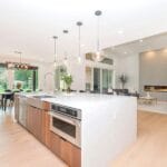 Open-plan kitchen connected to a living and dining area